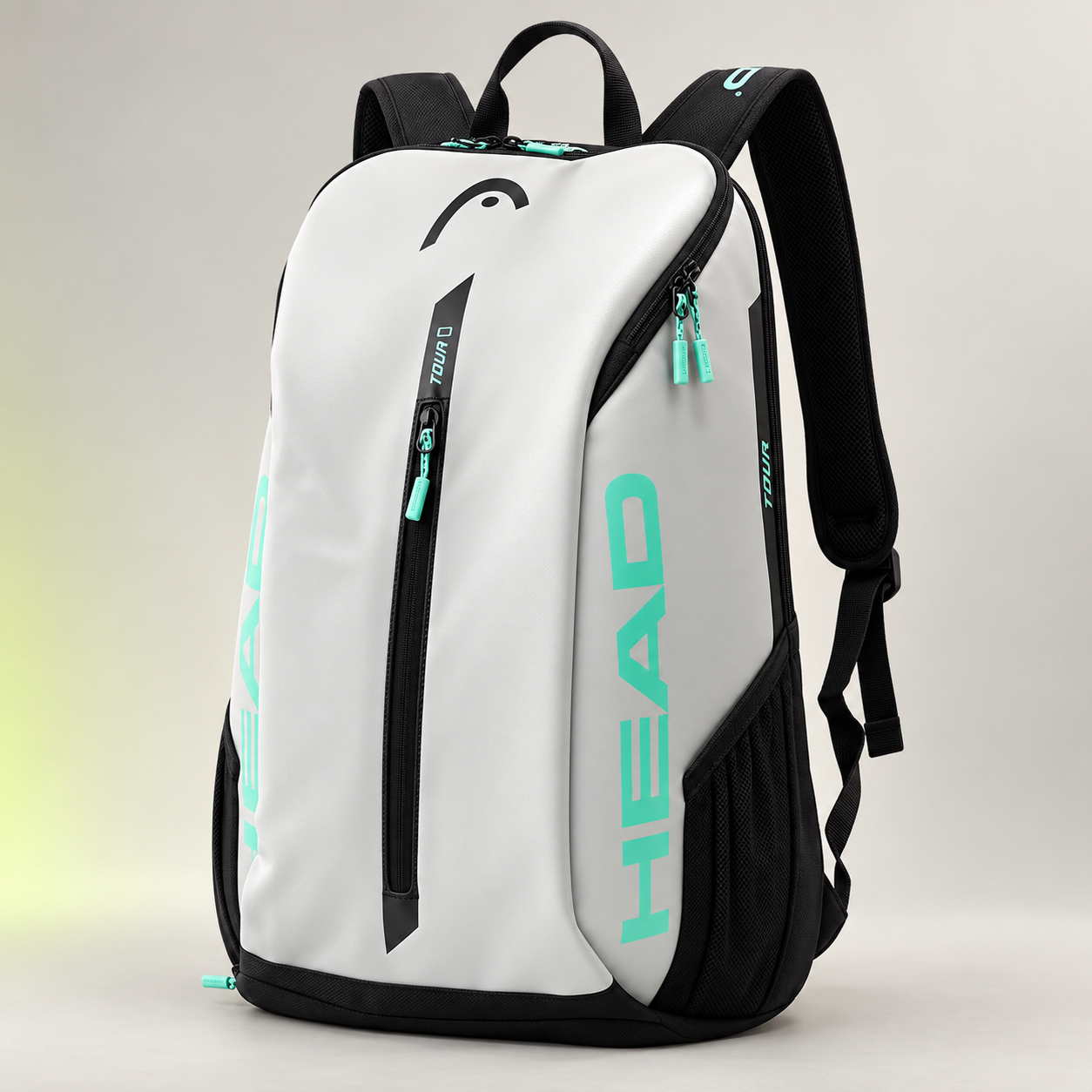 HEAD Tour 25L white, black and teal racquet backpack with dedicated shoe and equipment compartments.